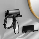 Wall-mounted hair dryer holder with cord management and accessory storage