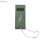 Olive green triple-tone survival whistle for emergency signaling.