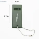 Olive green triple-tone survival whistle for emergency signaling.