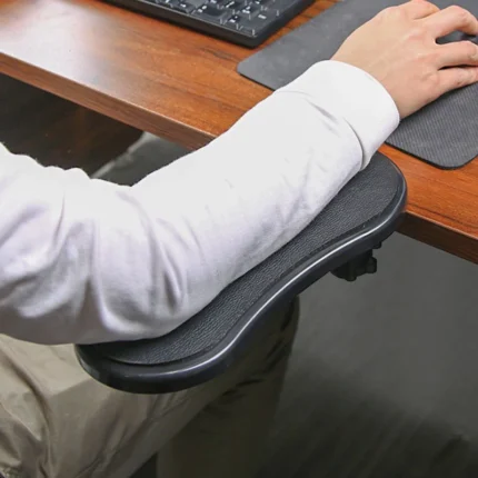 Ergonomic desk armrest with clamp, adjustable swivel support for computer.