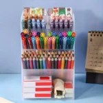 Frosted acrylic multi-tiered desk organizer with pens and pencils