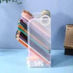 Frosted acrylic multi-tiered desk organizer with pens and pencils