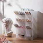 Frosted clear multi-compartment desk organizer with pens and makeup brushes