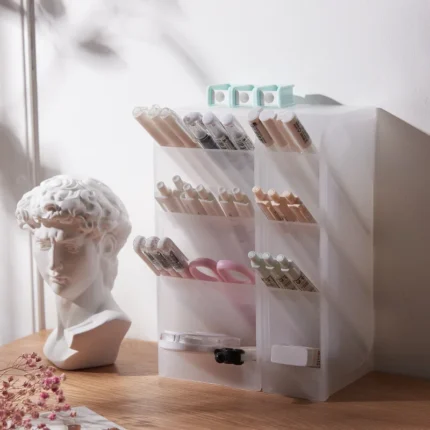 Frosted clear multi-compartment desk organizer with pens and makeup brushes