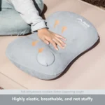 Grey inflatable camping pillow on sleeping bag in tent