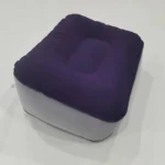 Inflatable travel footrest for airplane and office use