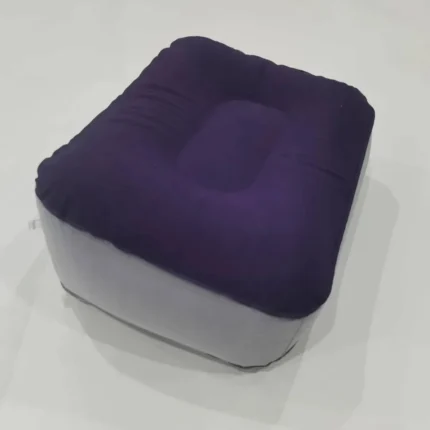 Inflatable travel footrest for airplane and office use