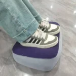 Inflatable travel footrest for airplane and office use