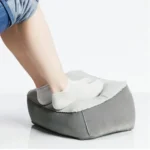 Inflatable travel footrest for airplane and office use