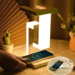 Levitating LED desk lamp with wireless charging and USB ports