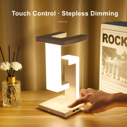 Levitating LED desk lamp with wireless charging and USB ports
