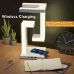 Levitating LED desk lamp with wireless charging and USB ports
