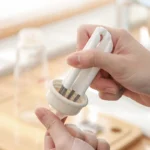 Multi-head crevice cleaning brush for keyboards and bottles