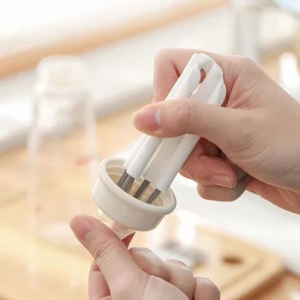 Multi-head crevice cleaning brush for keyboards and bottles