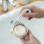 Multi-head crevice cleaning brush for keyboards and bottles