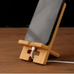 Natural bamboo phone stand with cable management for desk
