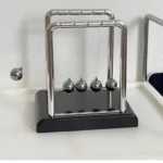 Newton's Cradle balance balls, chrome frame, black base