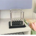 Newton's Cradle balance balls, chrome frame, black base
