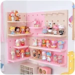 Pink pegboard wall organizer with shelves for cute collectibles.