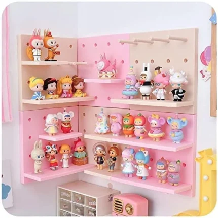 Pink pegboard wall organizer with shelves for cute collectibles.