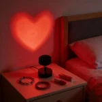 Red heart projection lamp creating romantic bedroom ambiance