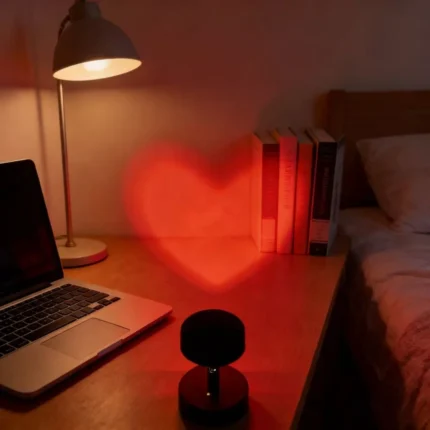 Red heart projection lamp creating romantic bedroom ambiance