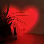 Red heart projection lamp creating romantic bedroom ambiance