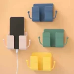 Self-adhesive wall phone holder with charging slot and side hooks