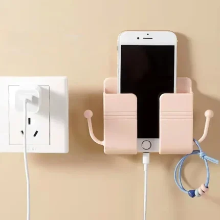 Self-adhesive wall phone holder with charging slot and side hooks