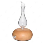 Silent waterless essential oil nebulizer with wood and glass design.