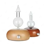 Silent waterless essential oil nebulizer with wood and glass design.