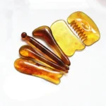 6-piece amber Gua Sha and massage tools for face and body.