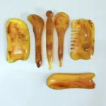 6-piece amber Gua Sha and massage tools for face and body.