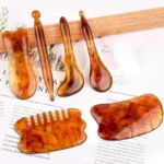 6-piece amber Gua Sha and massage tools for face and body.