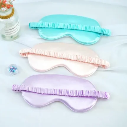 Soft satin sleep mask set in pastel colors for relaxation.