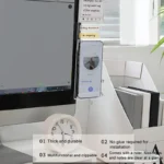 Clear monitor side organizer holding notes and smartphone