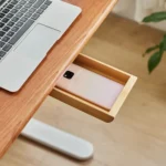Under desk slide-out wood drawer with adhesive installation.