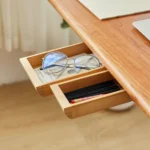 Under desk slide-out wood drawer with adhesive installation.