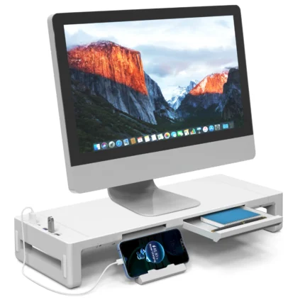 White monitor stand with USB hub, charging ports, and storage drawer.