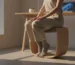 Person enjoying active sitting benefits on a balance stool.